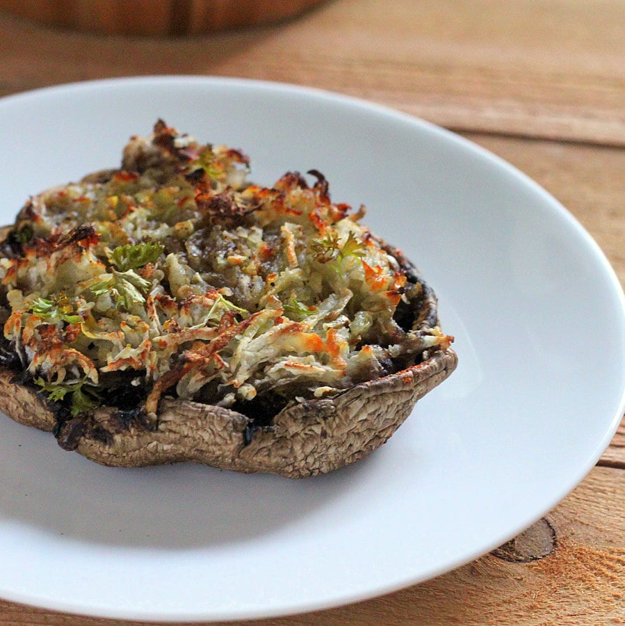 Portabella stuffed with Hash browns. Cheesy russet potato shreds stuffed in mushrooms and baked. | VeganRicha.com #vegan #glutenfree #breakfast