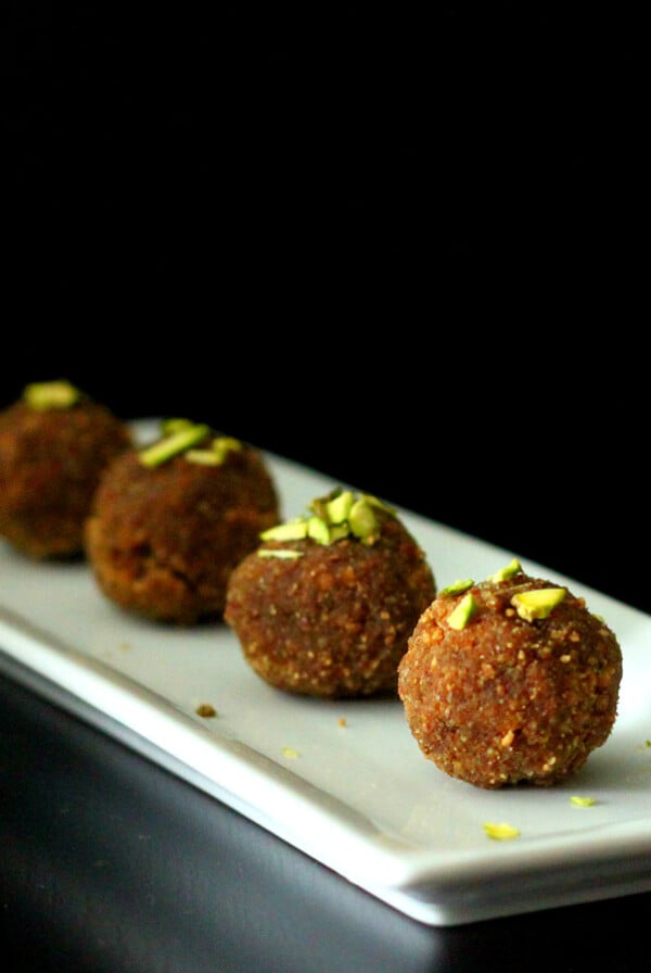 wheat ladoo served on a white oblong plate