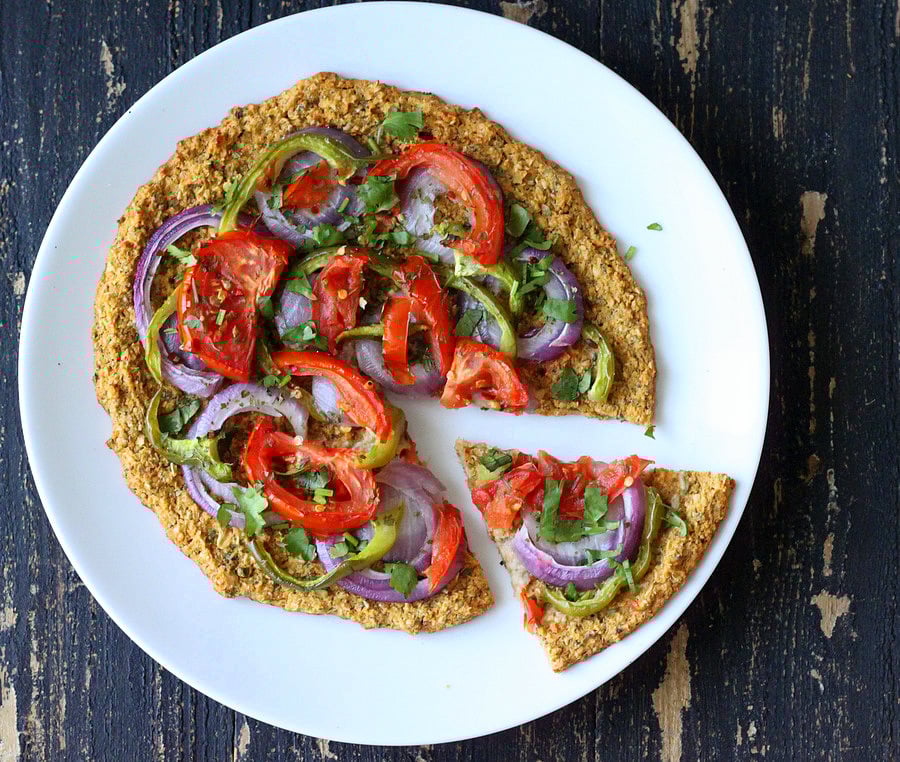 Spinach & Mung Bean Sprout Pizza Crust Pizza topped with Red onion, green bell pepper, tomatoes
