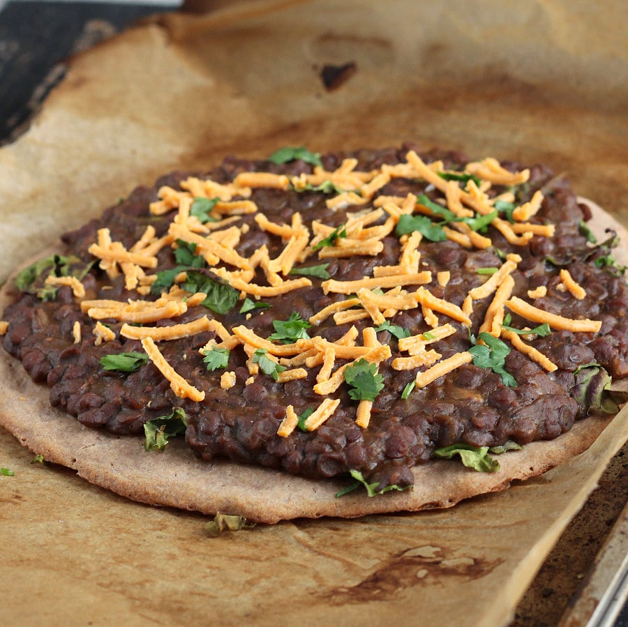 Missir Wot Pizza - Ethiopian Red lentil stew and Kale on Gluten free teff pizza crust. Gluten-free Pizza with ethiopian lentil topping. | VeganRicha.com #vegan #glutenfree #recipe