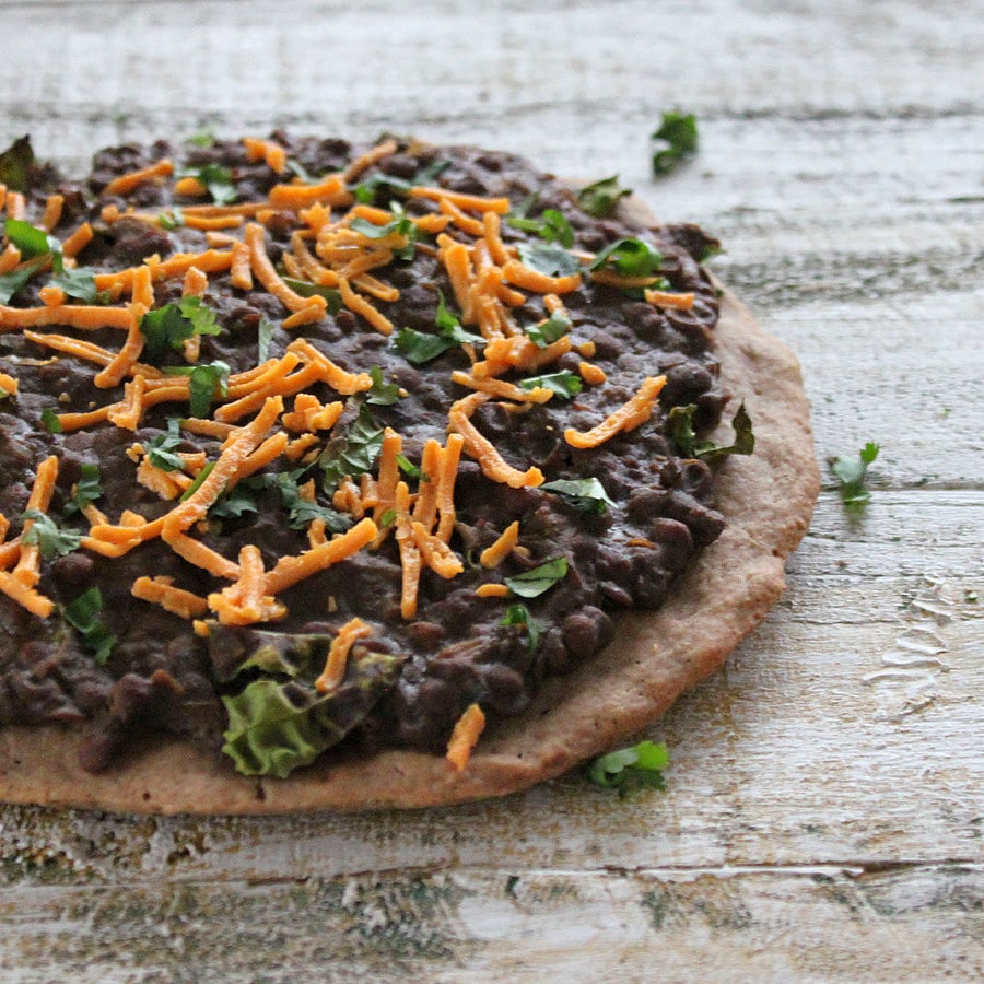 Missir Wot Pizza - Ethiopian Red lentil stew and Kale on Gluten free teff pizza crust. Gluten-free Pizza with ethiopian lentil topping. | VeganRicha.com #vegan #glutenfree #recipe