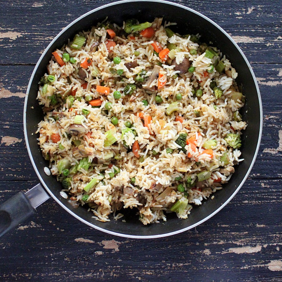 Vegan Garlic Fried Rice with Celery, Mushrooms, Broccoli, Bell Peppers, Carrots and Peas | https://veganricha.com #vegan #glutenfree