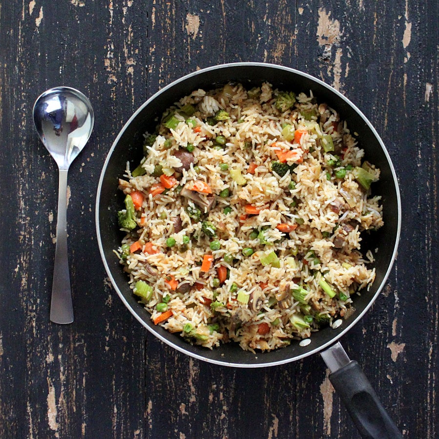 Vegan Garlic Fried Rice with Celery, Mushrooms, Broccoli, Bell Peppers, Carrots and Peas | https://veganricha.com #vegan #glutenfree