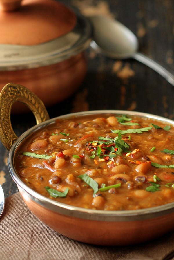 This daal has whole green mung bean and Black eyed Peas. When cooked together, the mung bean gets mushy and makes for a thick gravy.