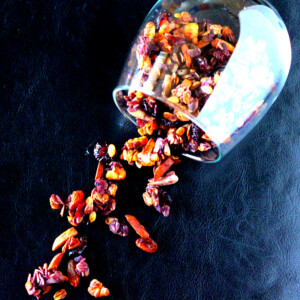 Berry Granola spilling out of a tumbler