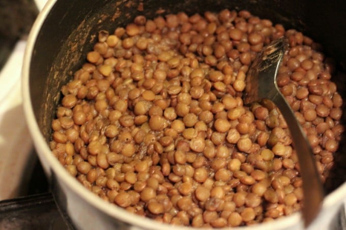 lentils cool in a stainless steel pot with spoon
