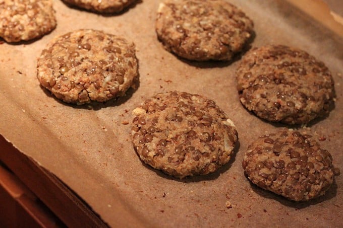 raw lentil cauliflower patties on parchment paper
