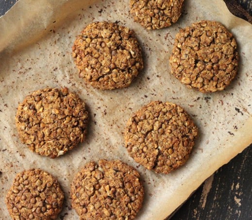 baked red lentil cauliflower patties on parchment paper