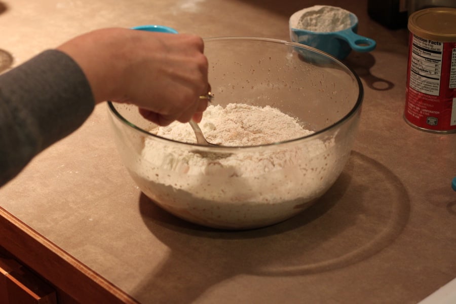 vegan cinnamon rolls  dry ingredients being mixed with activated yeast to make vegan cinnamon rolls recipe