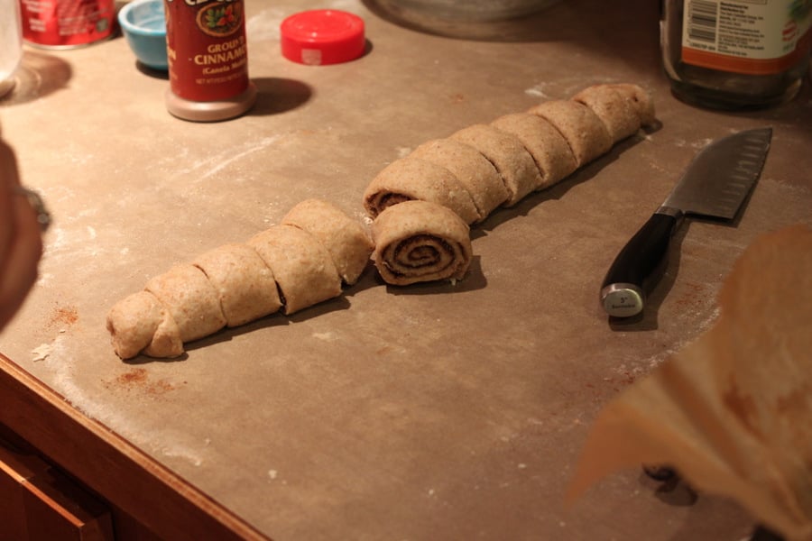 vegan cinnamon rolls  cinnamon rolls being cut