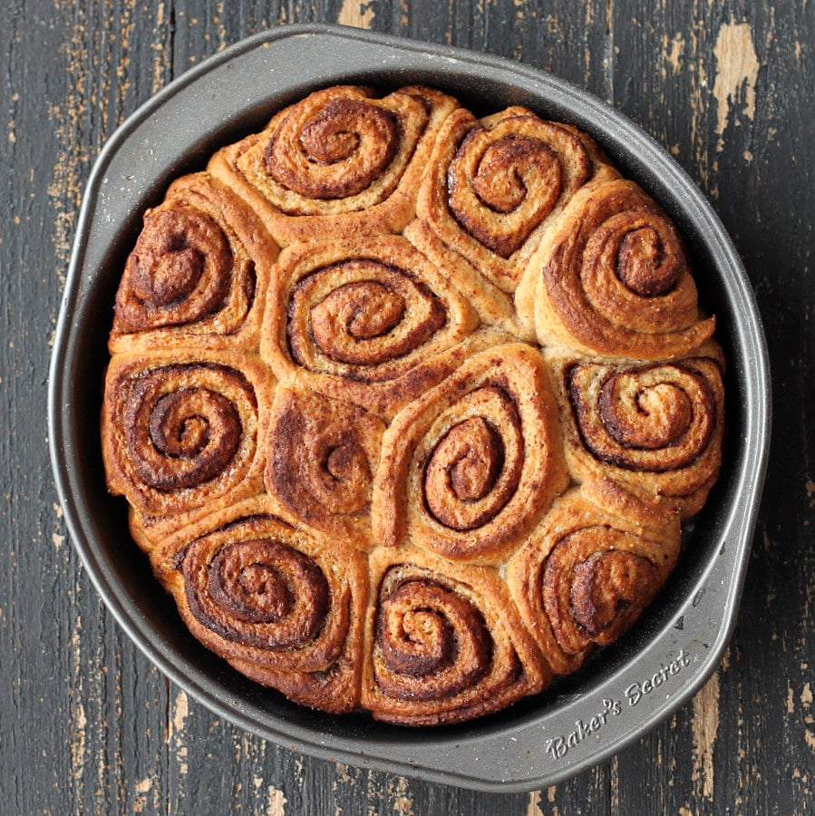 Vegan Cinnamon Rolls overhead shot of freshly baked Vegan Cinnamon rolls in a round metal cake pan