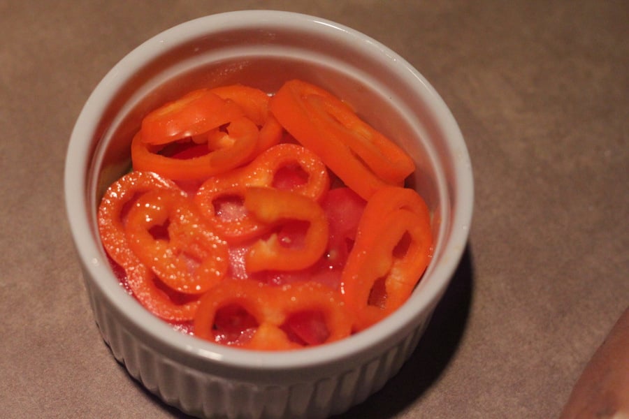 alfredo bake sliced mini bell pepper in a small white casserole dish