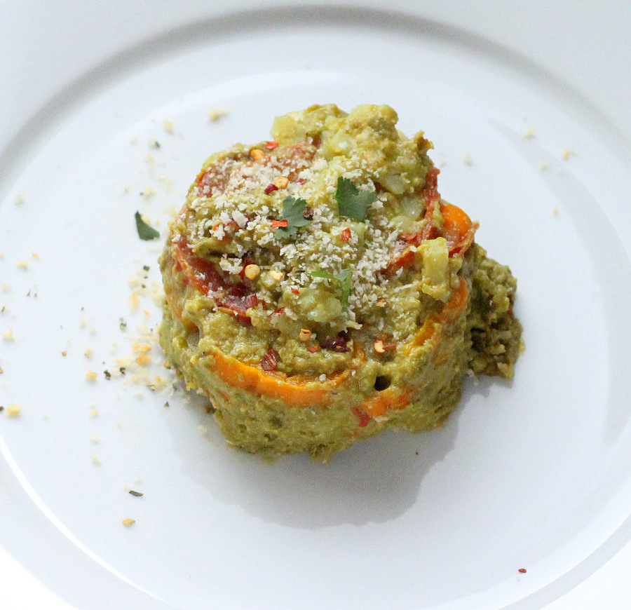 Alfredo bake overhead shot of side view of an individual serving of vegan sweet potato Alfredo bake with spinach cashew alfredo sauce