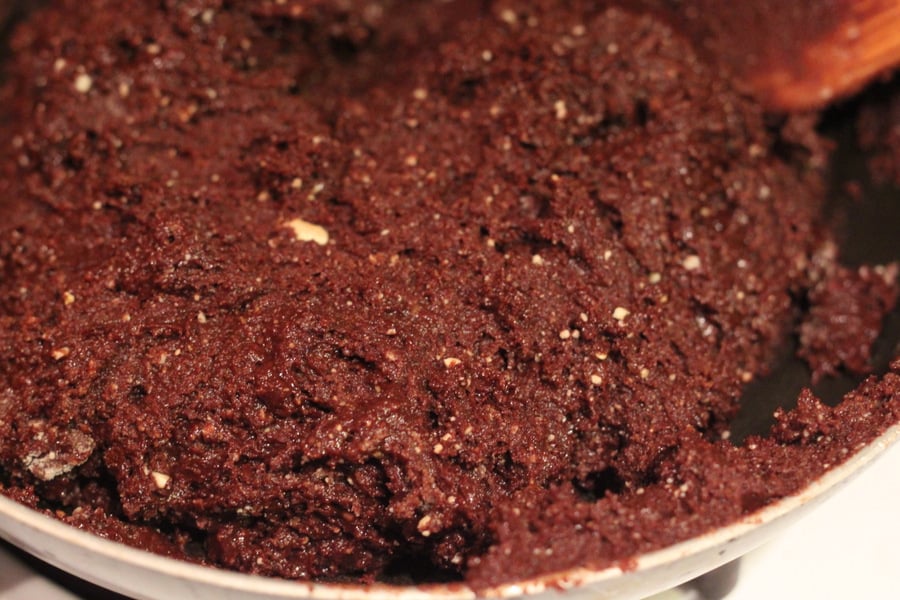 salted caramel brownies vegan triple chocolate brownie batter being pressed into a baking pan