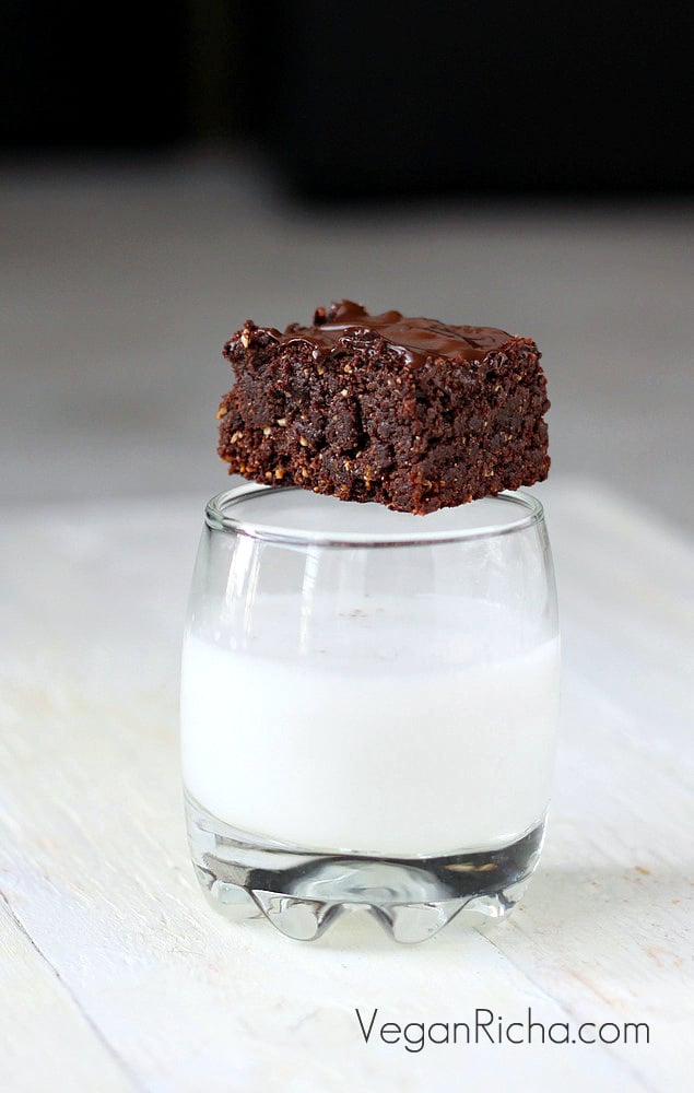 salted caramel brownies a vegan triple chocolate salted caramel brownie placed on a milk glass