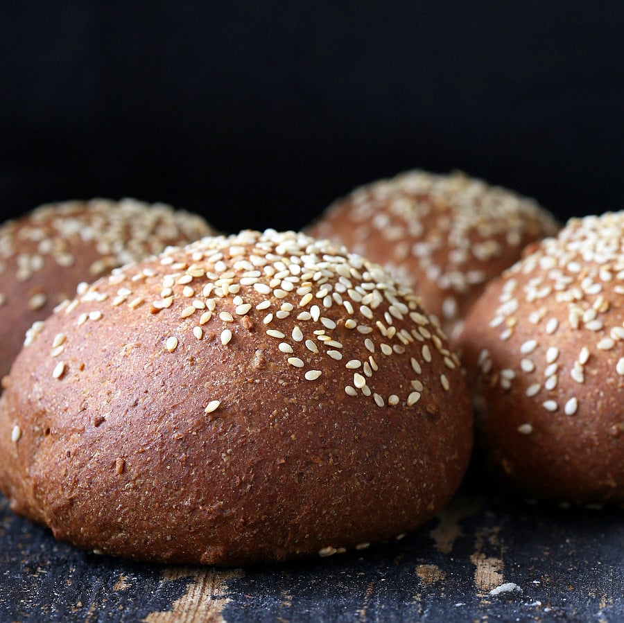 vegan burger buns  side view of vegan burger buns sprinkled with sesame seeds