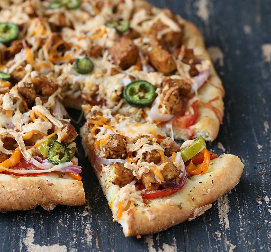 Tandoori Tempeh, Mini Peppers, Pepper Jack Pizza on Crisp White crust Vegan Tandoori Tempeh, Mini Peppers, Pepper Jack Pizza on Crisp White crust