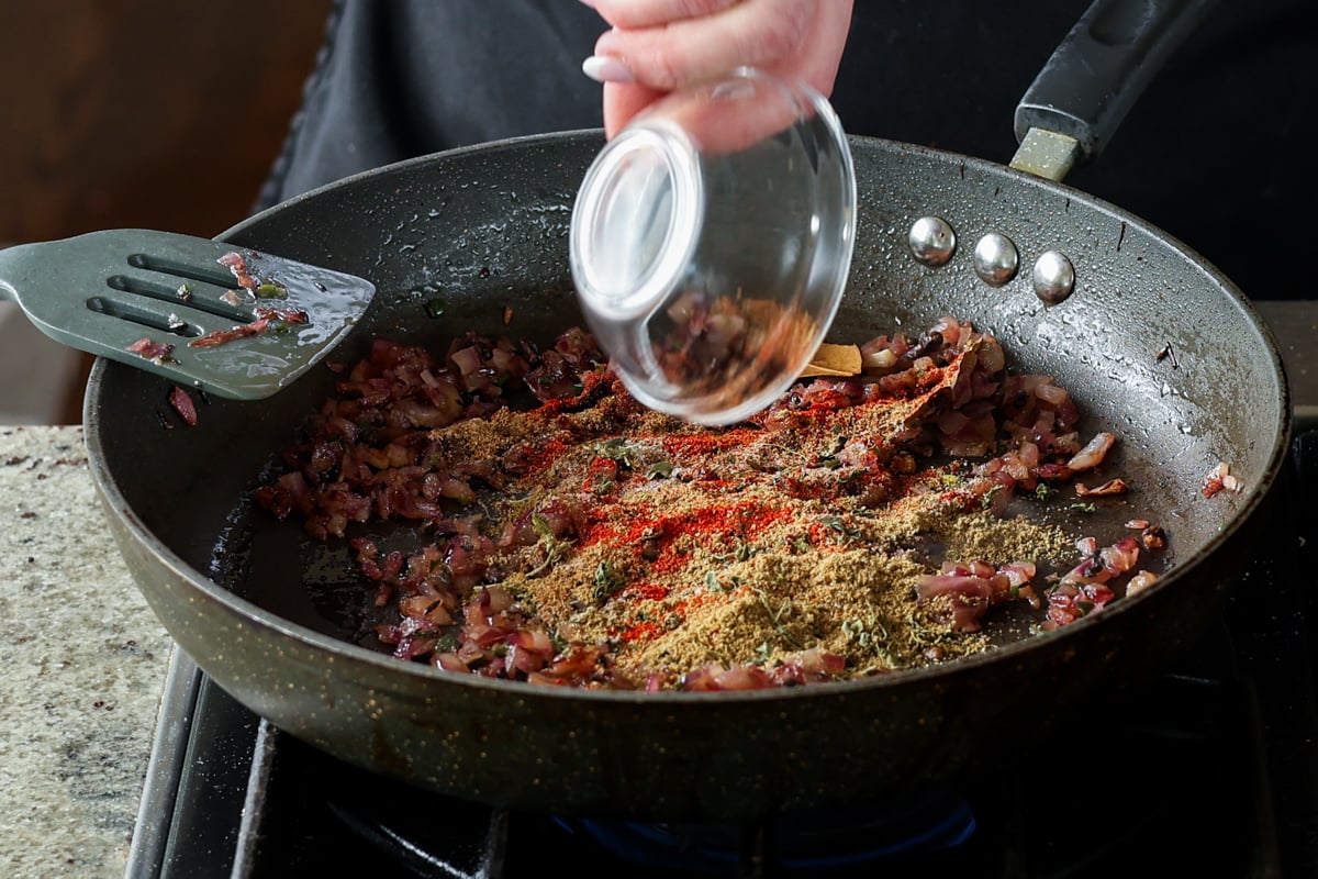 adding ground spices to the pan