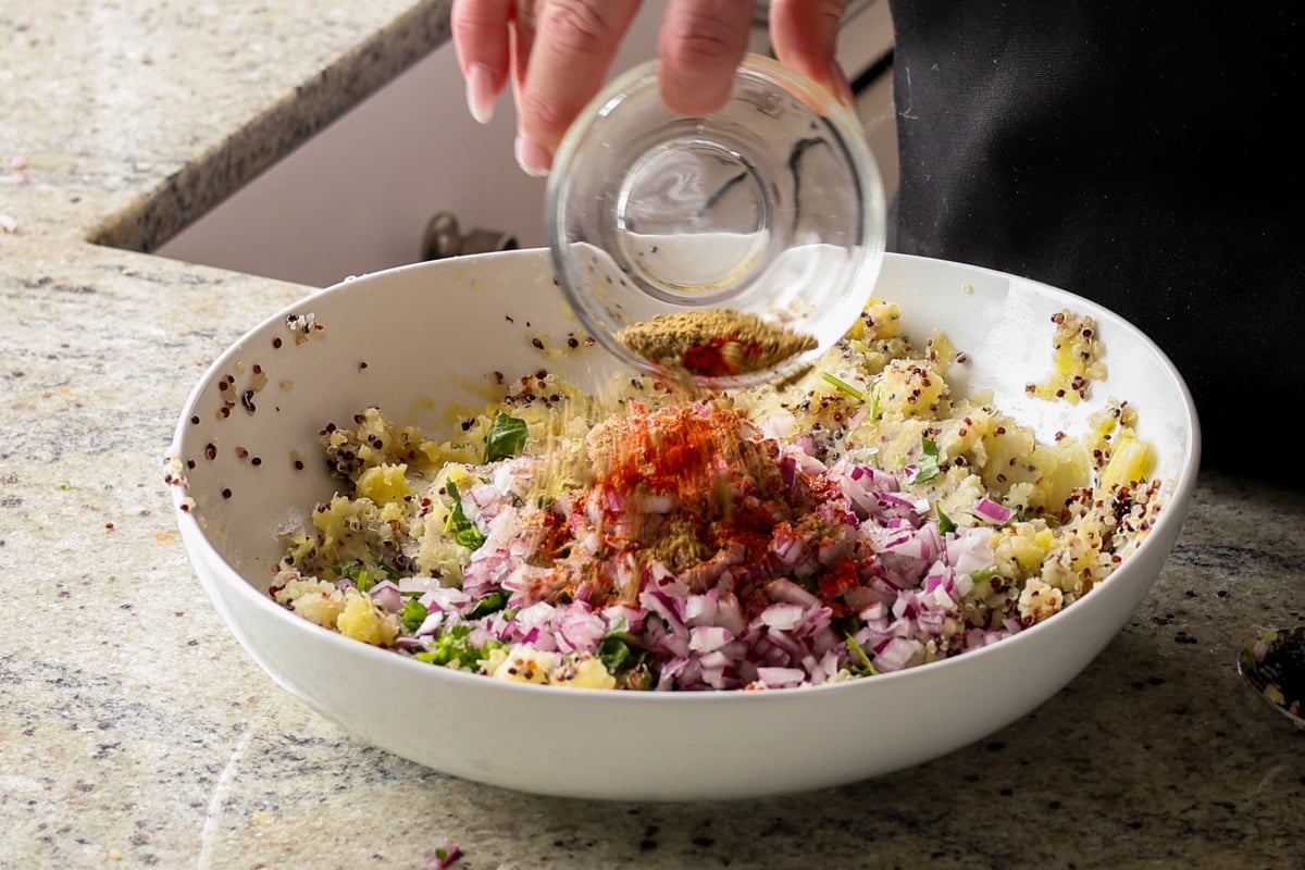 adding remaining tikki ingredients to the bowl