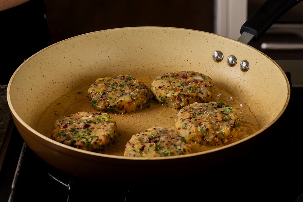 frying the tikkis in the pan