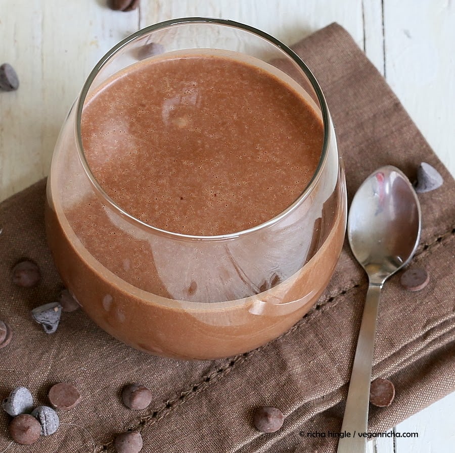 vegan milkshake  overhead shot of a glass with healthy creamy and thick vegan chocolate milkshake