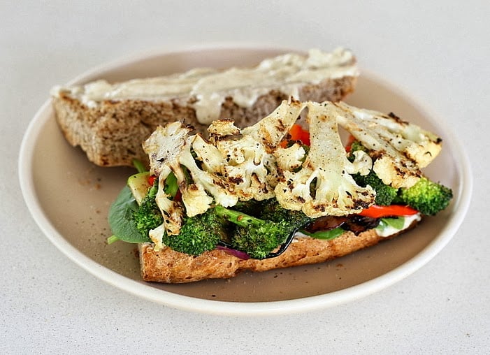 vegetable sandwich  healthy almond flour sandwich bun topped with roasted cauliflower and broccoli florets