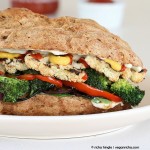 side view close-up of roasted vegan vegetable sandwich with sriracha mayo