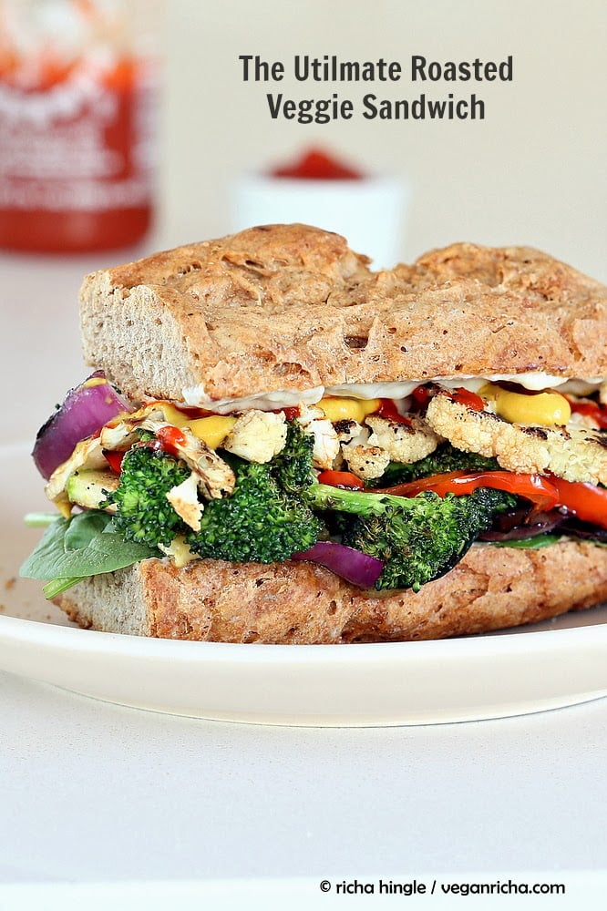 vegetable sandwich  side view of a healthy vegan roasted vegetable sandwich with sriracha mayo and mustard