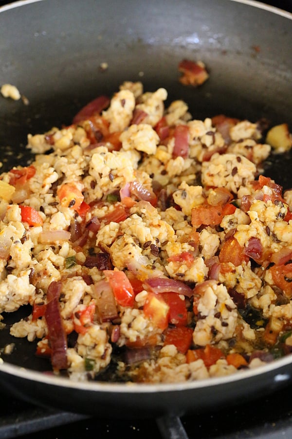 tempeh scramble  vegan tempeh scramble sauteeing in a pan with veggies