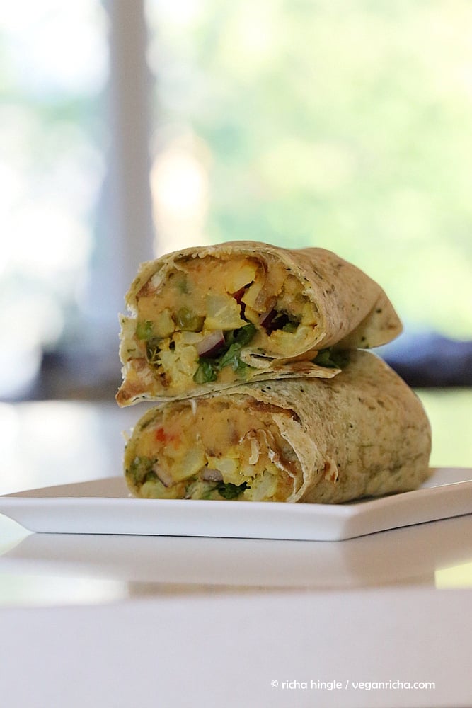 vegan hummus wrap  a cut and stacked vegan red lentil hummus wrap with cauliflower and broccoli