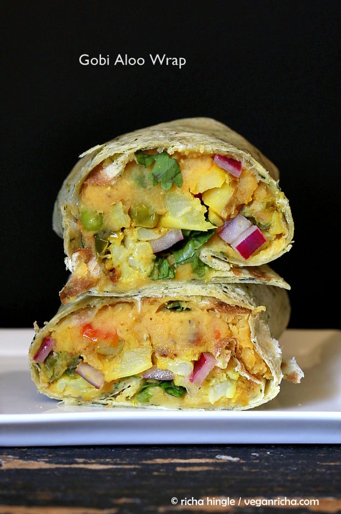 vegan hummus wrap  stacked vegan red lentil hummus wraps with pickled onions, potatoes and cauliflower