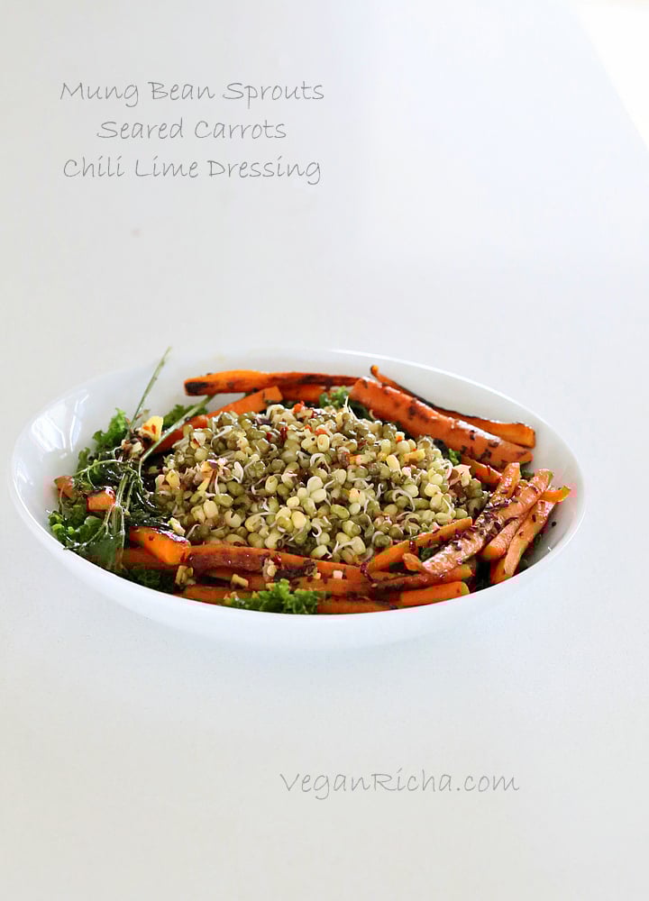 kale salad recipe side view of a healthy kale salad topped with sauteed sprouted mung beans and seared carrots