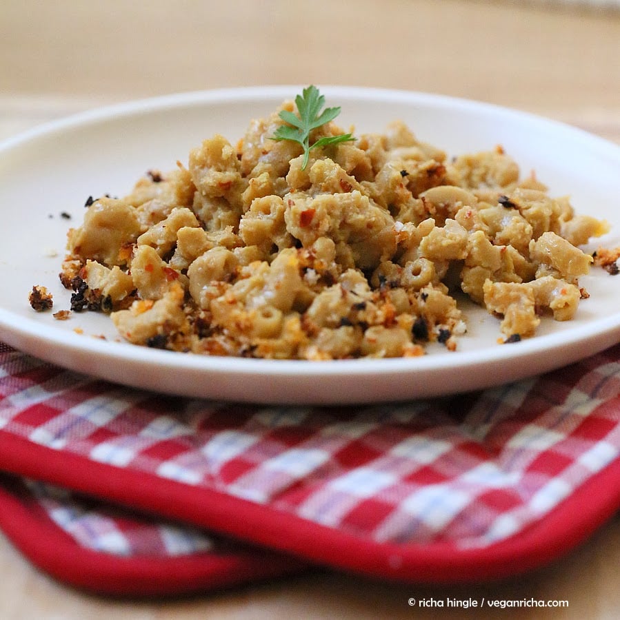 Cajun mac and cheese side view of a serving of vegan Spicy Cajun mac and cheese with breadcrumb topping