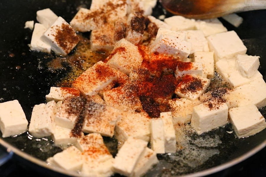 Tofu with spices in a skillet for our Vegan Palak tofu Paneer