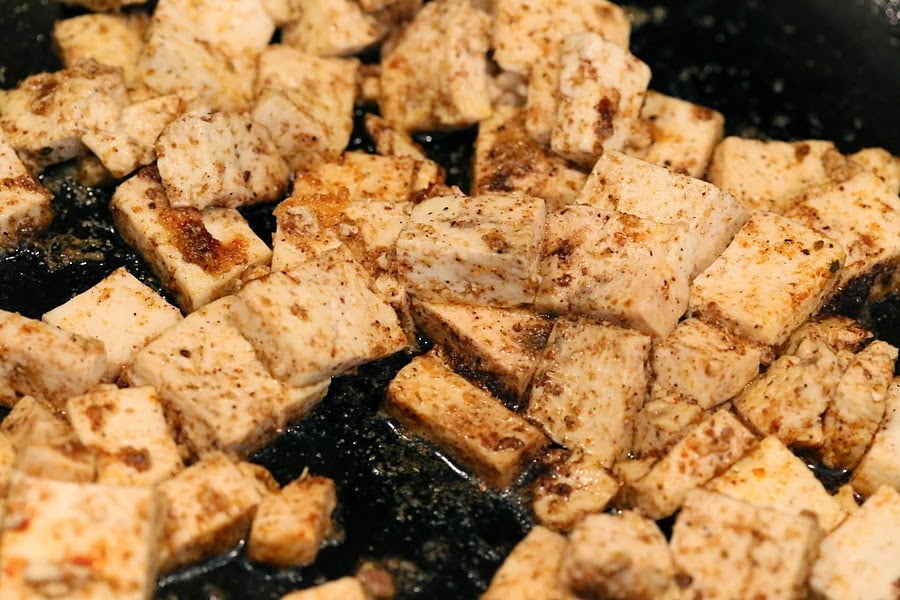 Tofu with spices in a skillet for our Vegan Palak tofu Paneer