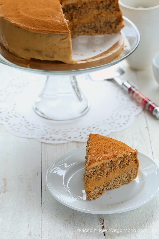 mousse cake a slice of healthy vegan pumpkin mousse cake next to a glass cake stand