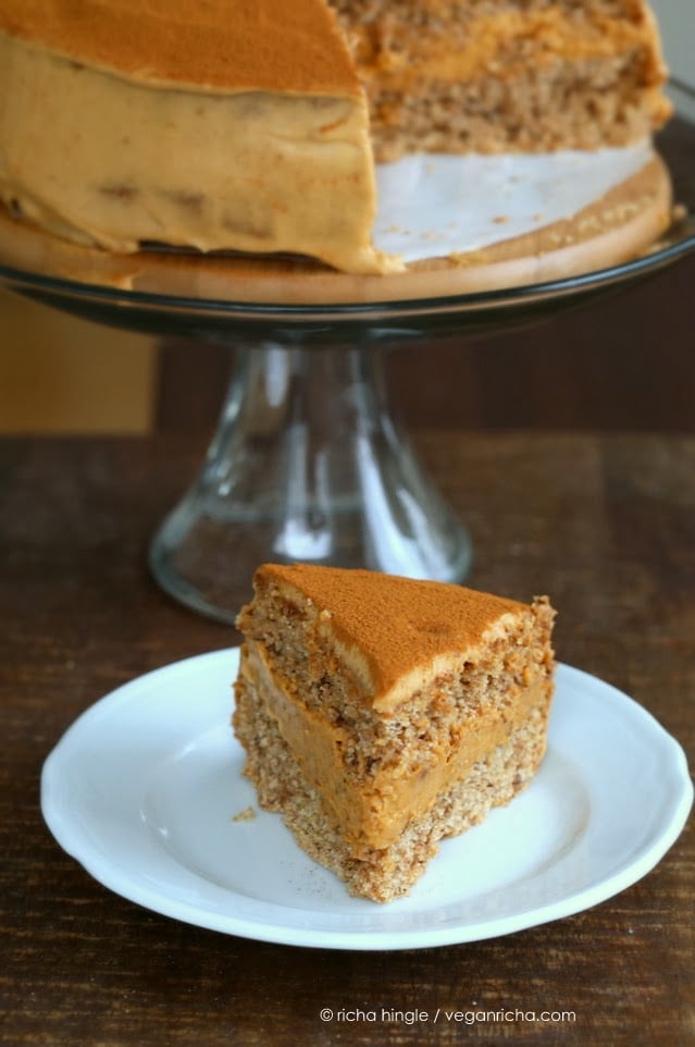 mousse cake a slice of vegan pumpkin mousse cake with spelt flour vanilla sponge on a white dessert plate
