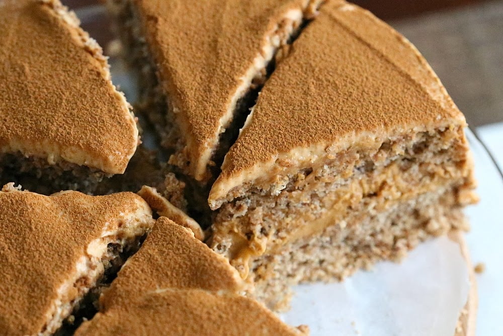mousse cake close-up overhead shot of a vegan pumpkin layer cake filled with pumpkin mousse on a cake stand