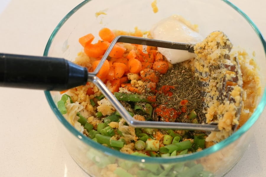 stuffed portobello mushrooms  chickpea stuffing ingredients for stuffed portobello mushrooms recipe being mixed in a bowl
