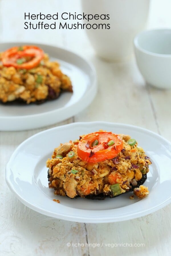 side view of vegan stuffed Portobello Mushrooms on a white plate