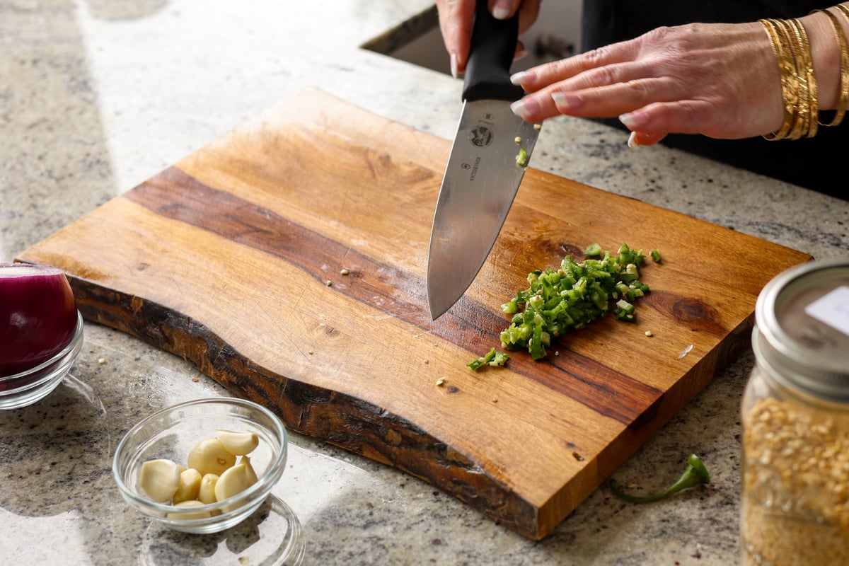 chopping the green chili