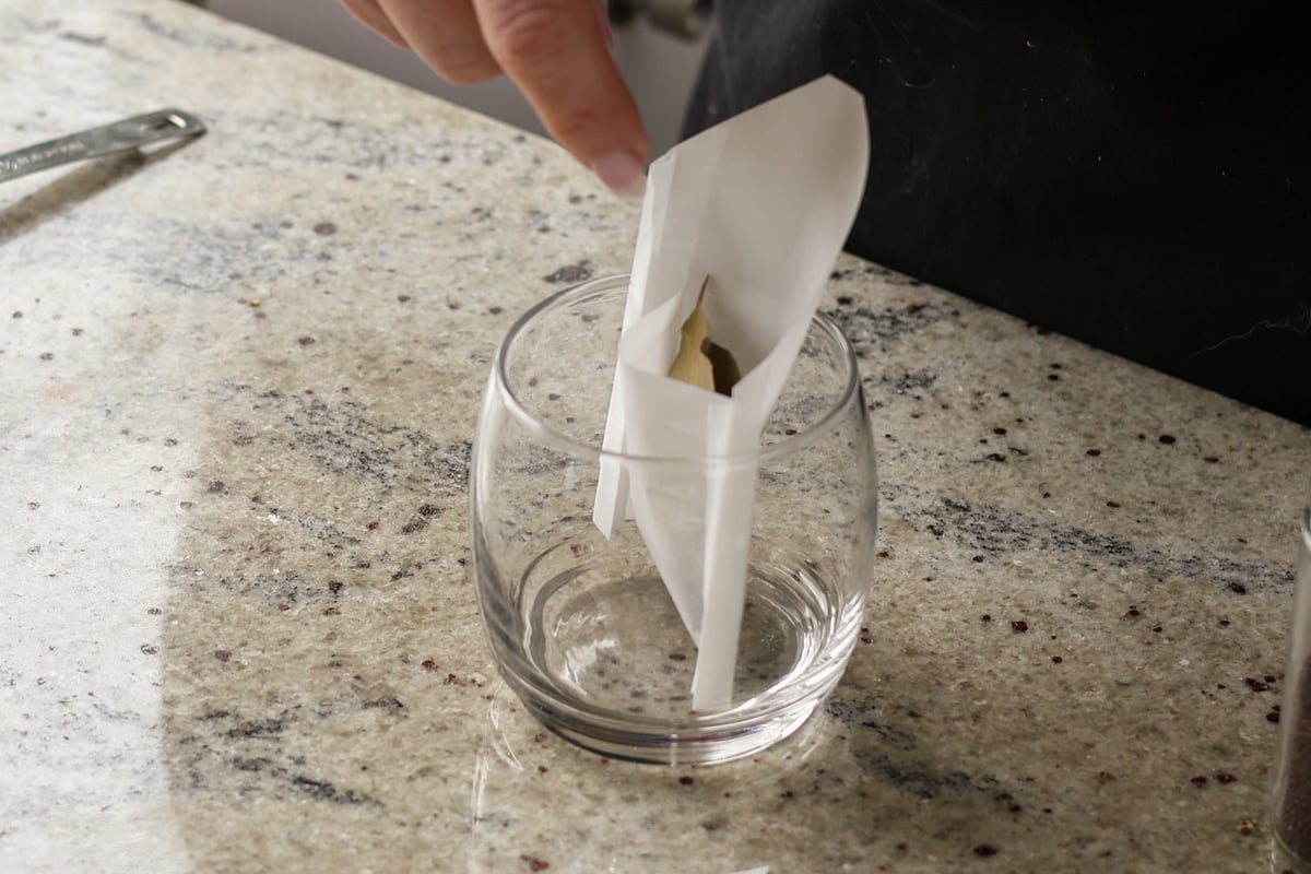 adding dried curry leaves to the pouch