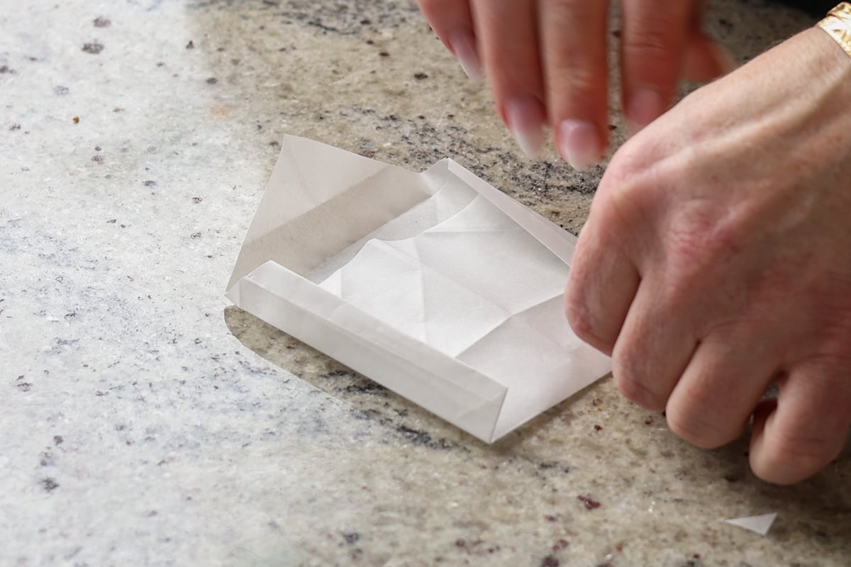 folding the top of the pouch
