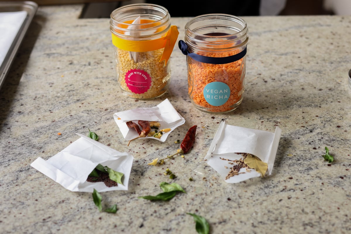 open jars of lentil soup mix with open spice pouches