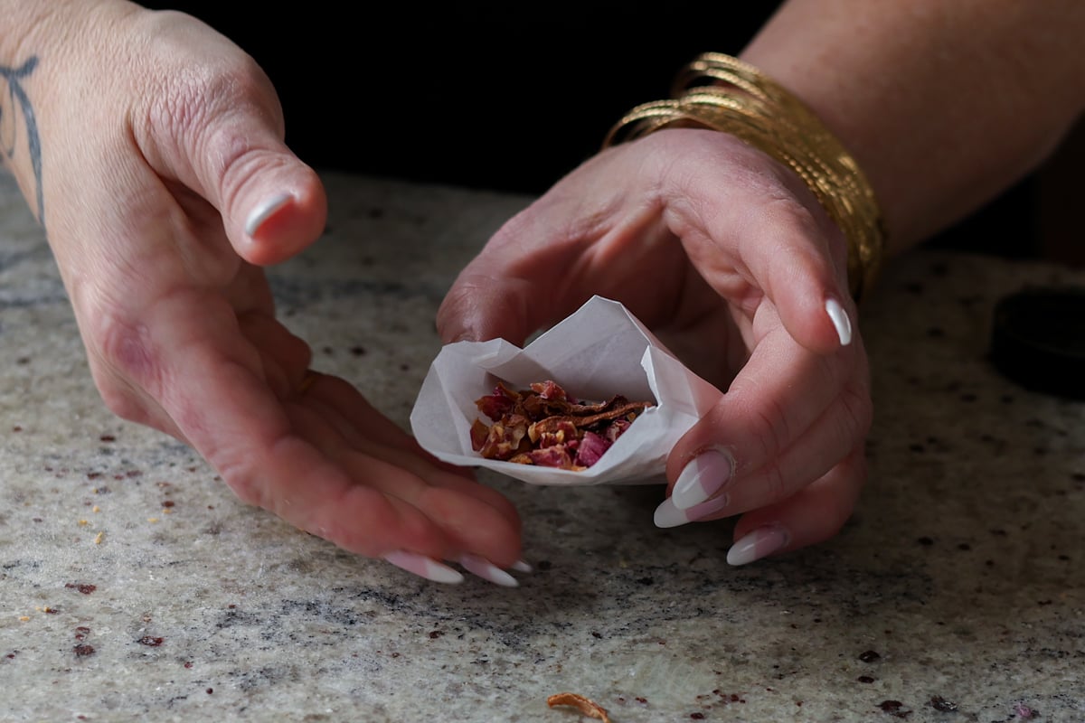 adding dried onion to the pouch