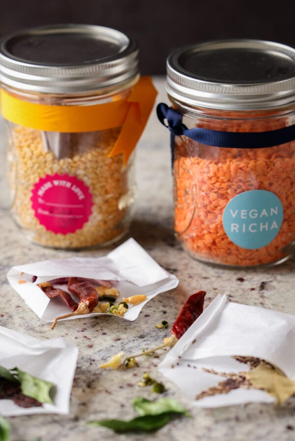 open jars of lentil soup mix with open spice pouches