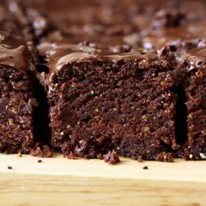 close-up side view of triple chocolate salted caramel brownie