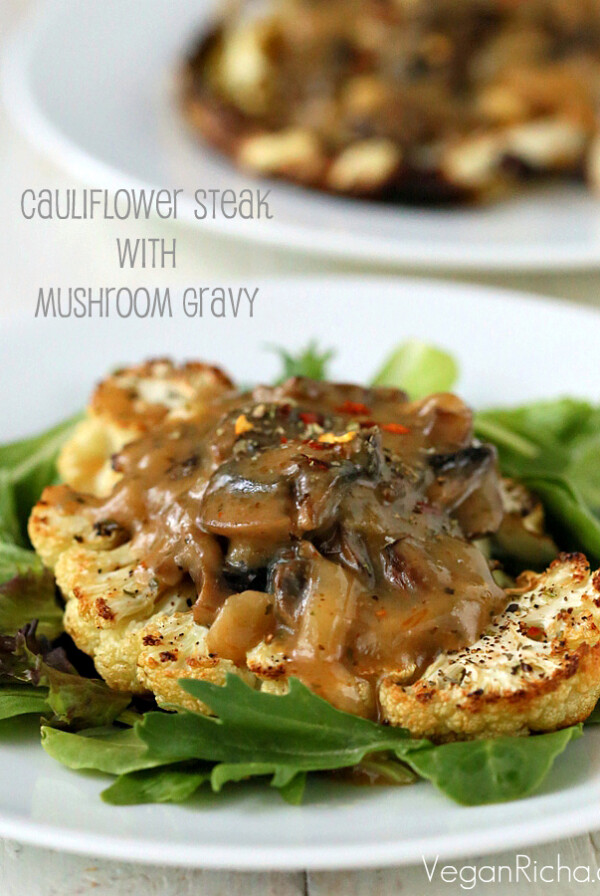 Cauliflower Steaks with Mushroom Gravy. Easy Roasted Cauliflower Slices served with mushroom thyme gravy. Vegan gluten-free Festive Main for the holidays.