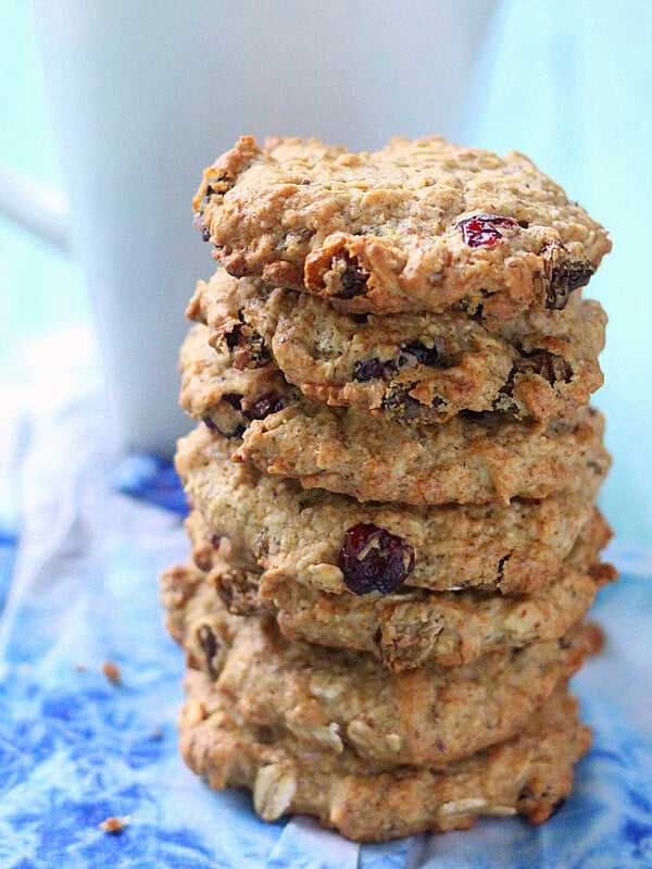 A stack of Cranberry Chocolate chip Oatmeal cookies on a blue background