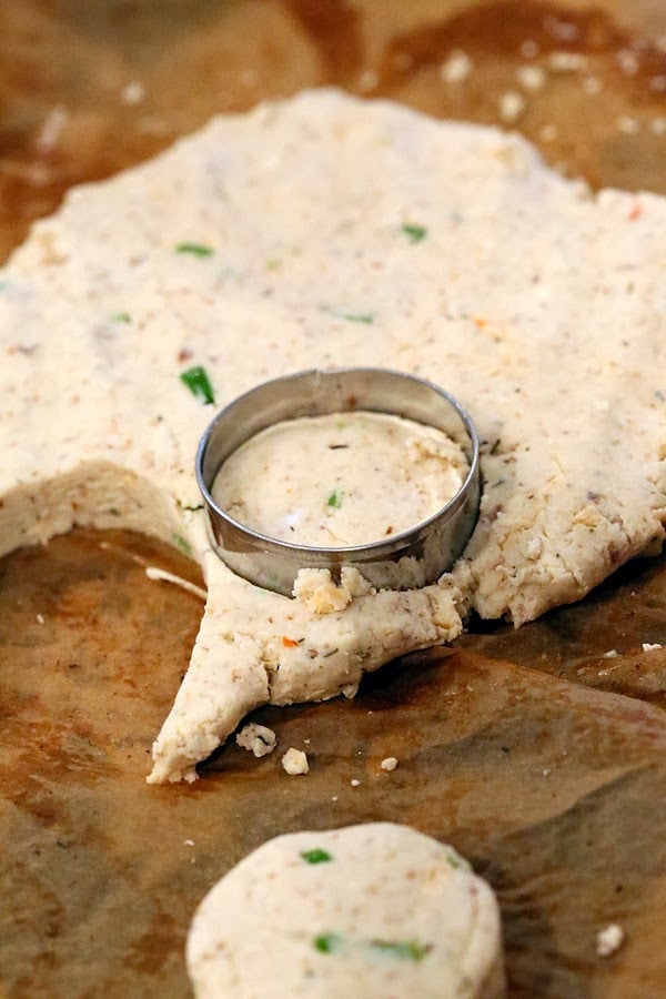 gluten free biscuits recipe gluten-free cheese biscuits being cut out using round metal cookie cutters